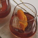A glass of Old Fashioned cocktail. Click to find our recipe for an Old Fashioned